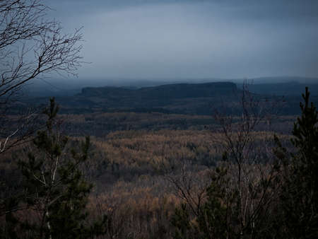 Amazing dark scenery and view to the deep valleys from top of mountains in north of Czech Republic.の写真素材