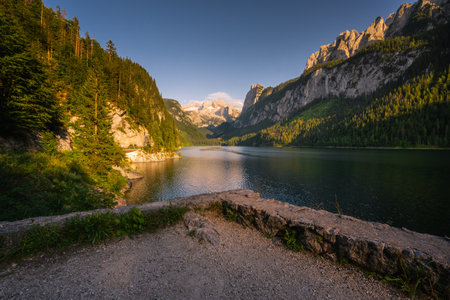 Amazing sunset scenery under the huge mountains. Glaciers cover with snow and unique magical lake in Austrian Alps, Europe.の写真素材