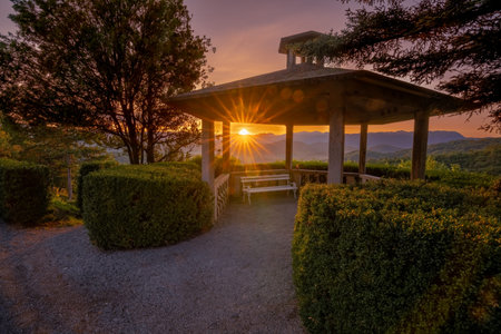 Romantic sunrise in small village on the countryside in Slovenian wild nature. Such a calm and peaceful moment when the sun rises above the horizon.の写真素材