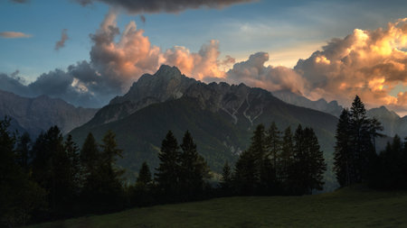 Romantic colorful sunset in the mountains on the border between Slovenia, Austria and Italy....