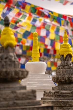 Colorful prayer flags and traditional Buddhist stupas in Swayambhunath area, known as monkey temple, Kathmandu, Nepal.の写真素材