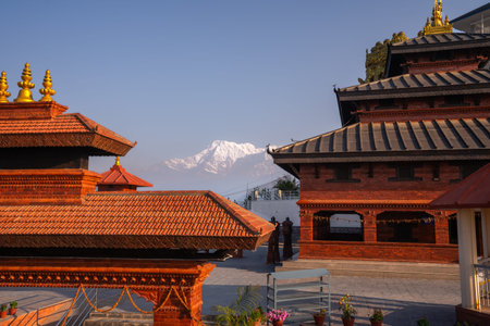 Morning time inside temple in Sarangkot hill area with magical view to Annapurna range in Nepal.