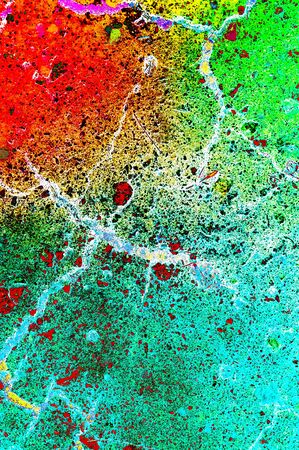 Old asphalt cracked background texture painted with rainbow processの写真素材