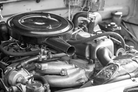 Under the hood cover of an old vintage car. Monochrome style photo.の写真素材