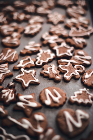 Vanilla cookies on white baking paper sheetの写真素材