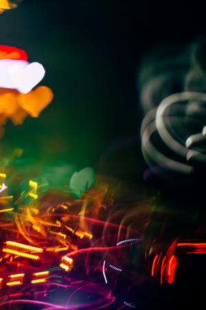 Abstract blurred colorful christmas bokeh background heart shape. Toned, style photo.の写真素材