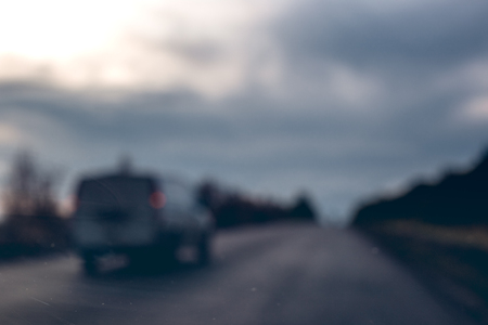 Blurred photo of car on the roadの写真素材