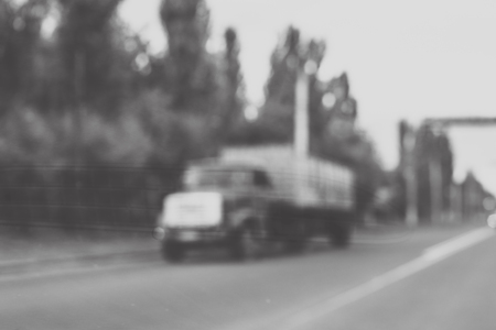 Blurred photo of truck on the roadの写真素材