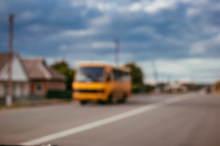 Blurred photo of bus on the roadの写真素材