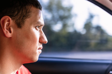 Portrait of a man driving a car
