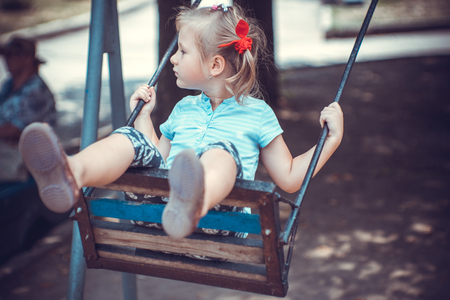 Cute little girl on the playgroundの写真素材