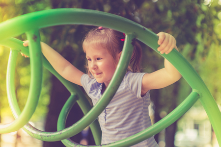 Cute little girl on the playgroundの写真素材