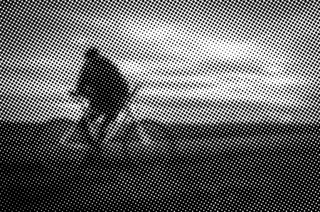 Man with bicycle at sunset - monochrome halftone pattern backgroundの写真素材