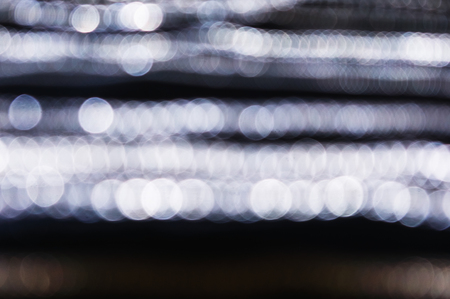 Silver abstract bokeh background for designの写真素材