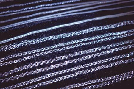 Silver chains on a black backgroundの写真素材