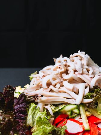 Ingredients for making salad on a green plate. Healthy eating concept.の写真素材