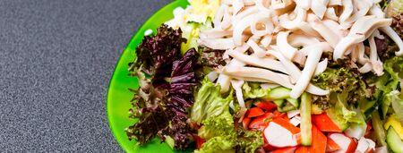 Ingredients for making salad on a green plate. Healthy eating concept.の写真素材