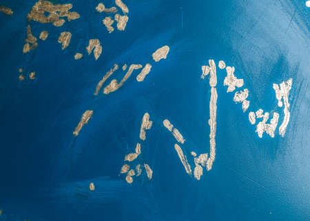 Blue abstract background for design with yellow dots. Painted scratch texture with place for textの写真素材