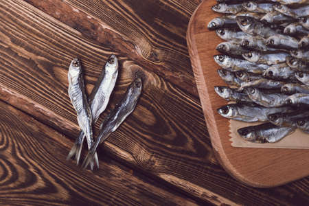 Dried fish on a wooden background. Studio photo.の写真素材