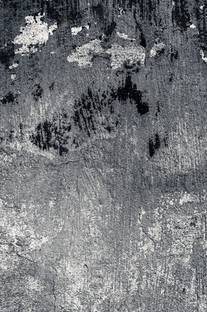 Cracked and peeling paint old wall background. Monochrome classic grunge texture