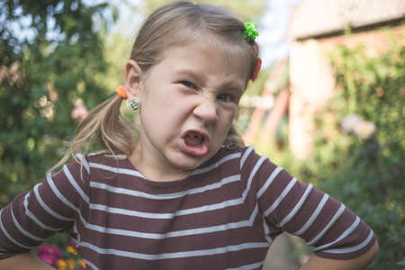 Child with a dental orthodontic device and without one tooth.の写真素材