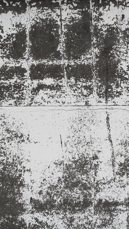 An old destroyed wall with cracks and scratches. Abstract grunge background texture for design posters, advertising and more.の写真素材