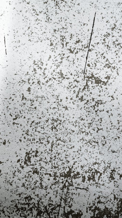 An old destroyed wall with cracks and scratches. Abstract grunge background texture for design posters, advertising and more.の写真素材