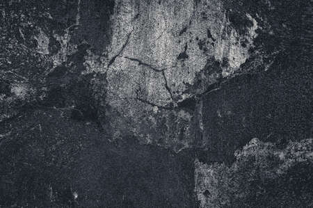 Cracked and peeling paint old wall background. Monochrome classic grunge textureの写真素材