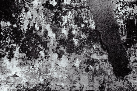 Cracked and peeling paint old wall background. Monochrome classic grunge texture
