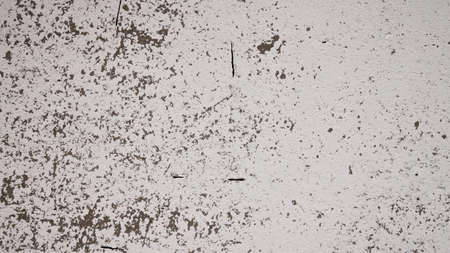 An old destroyed wall with cracks and scratches. Abstract grunge background texture for design posters, advertising and more.の写真素材