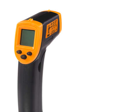 Yellow-black pyrometer isolated on white background. A device for non-contact temperature measurement. Studio photo.の写真素材