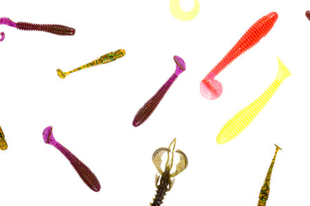 Multicolored silicone baits isolated on white background. Studio photo.