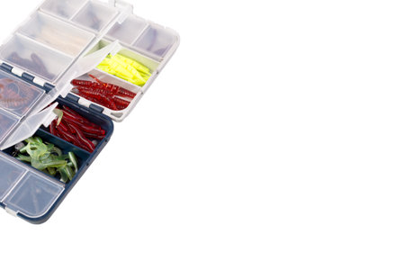 Transparent box with silicone fishing lures isolated on white backgroundの写真素材