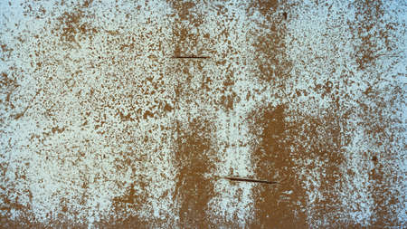 An old destroyed wall with cracks and scratches. Abstract grunge background texture for design posters, advertising and more.の写真素材