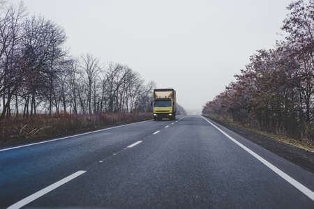 Truck on the road in the autumn.の写真素材