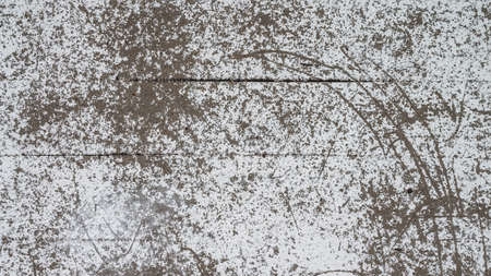 An old destroyed wall with cracks and scratches. Abstract grunge background texture for design posters, advertising and more.の写真素材