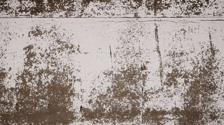 An old destroyed wall with cracks and scratches. Abstract grunge background texture for design posters, advertising and more.の写真素材
