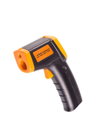 Yellow-black pyrometer isolated on white background. A device for non-contact temperature measurement. Studio photo.の写真素材