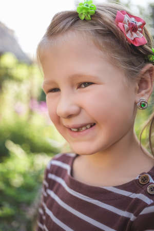 Child with a dental orthodontic device and without one tooth.の写真素材
