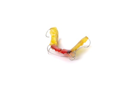 Colorful children's orthodontic appliance isolated on white background. Concept of oral health in...