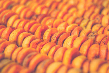The process of home cooking dried fruits in an electric dryer. The stage of dehydration of fruits for storage and consumption in the winter. Lots of dehydrated apricots.の写真素材