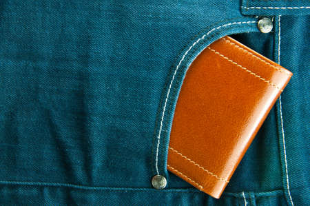 Blue jeans pocket with brown walletの写真素材