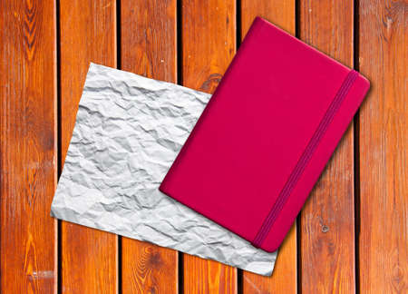 White blank page note book on wood table horizontalの写真素材