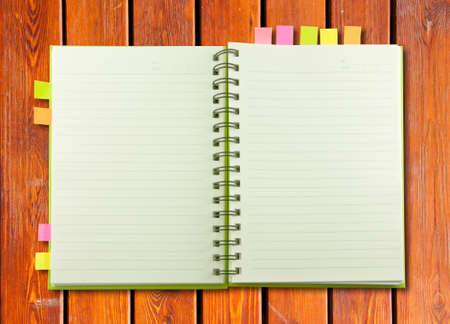 White blank page note book on wood table horizontalの写真素材