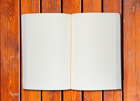White blank page note book on wood table horizontalの写真素材
