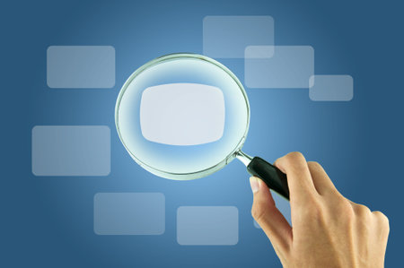 Magnifying glass and the working paper with a diagram. (Business concept)の写真素材