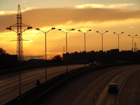 Sunset on the highway. Beautiful, scenic clouds.の写真素材