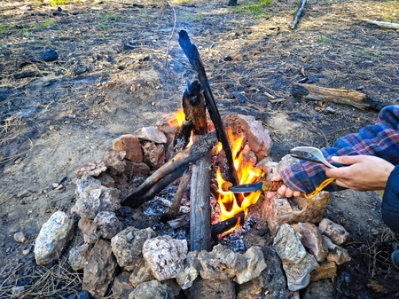 Evening campfire. Villager cooking and kitchen toolsの写真素材