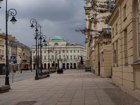 Warsaw/Poland. Streets of capital during coronavirus pandemic, usually very crowded with people or cars, now almost empty. Nowy Swiat street and Warsaw University.のeditorial素材