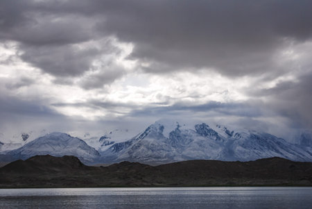 Kala Kule Lake with dramatic sky. Altay Prefecture, Xinjiang, China.